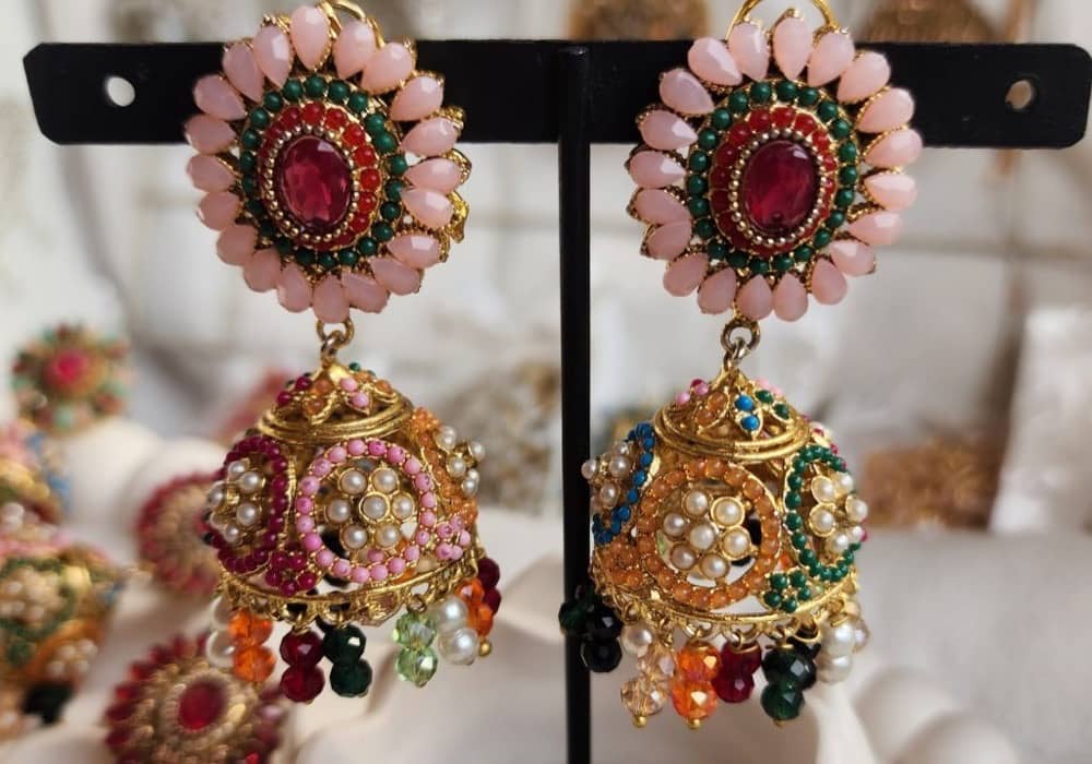 Rajwari milky-pink jhumki earrings with multi-colour pearl detailing