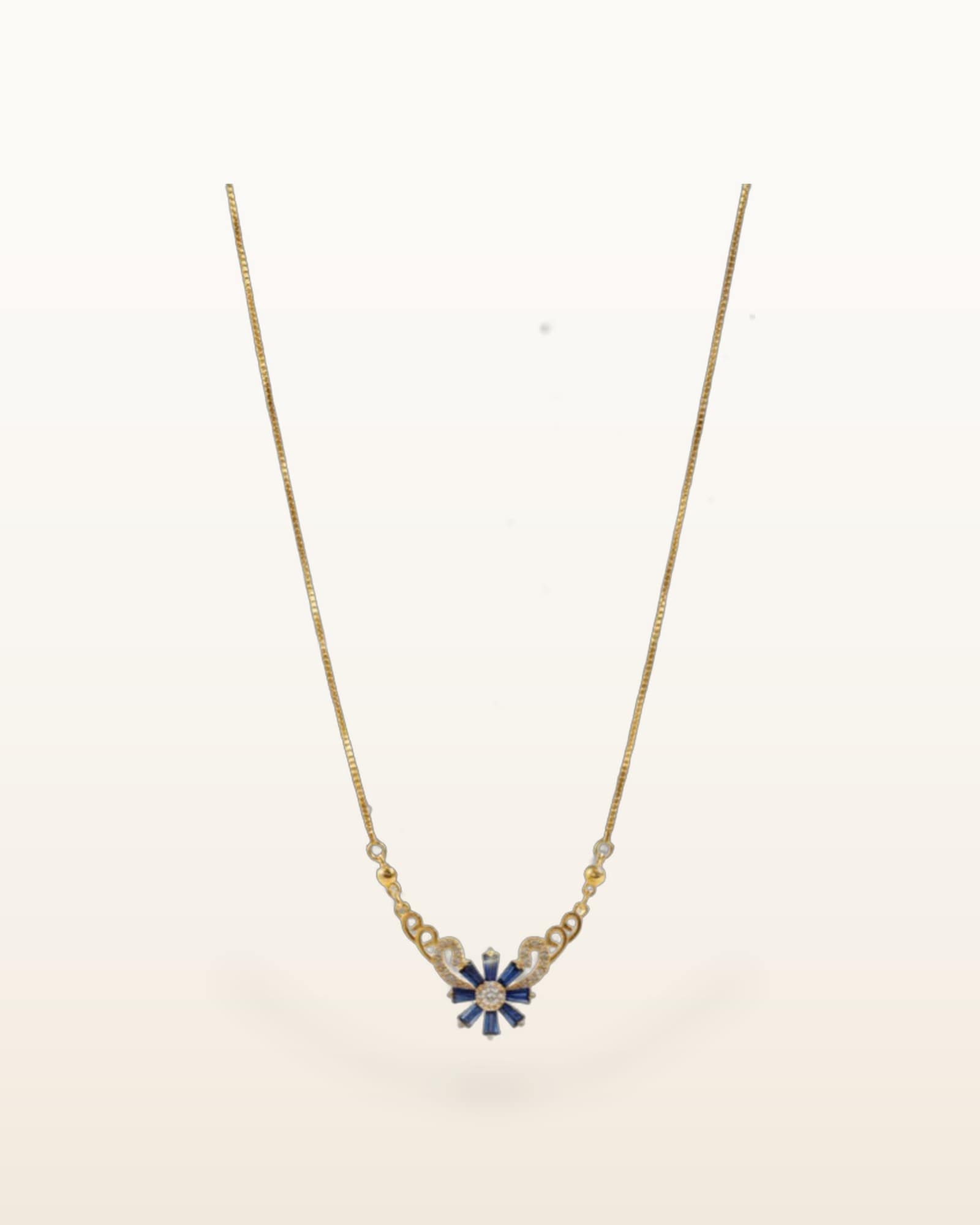 Ocean-blue floral pendant on a fine chain